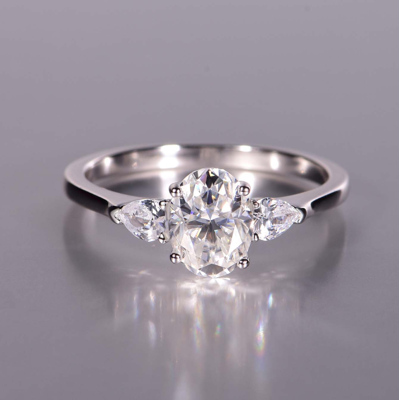 Oval Three-Stone Moissanite Ring with Pear Accents - Image 3