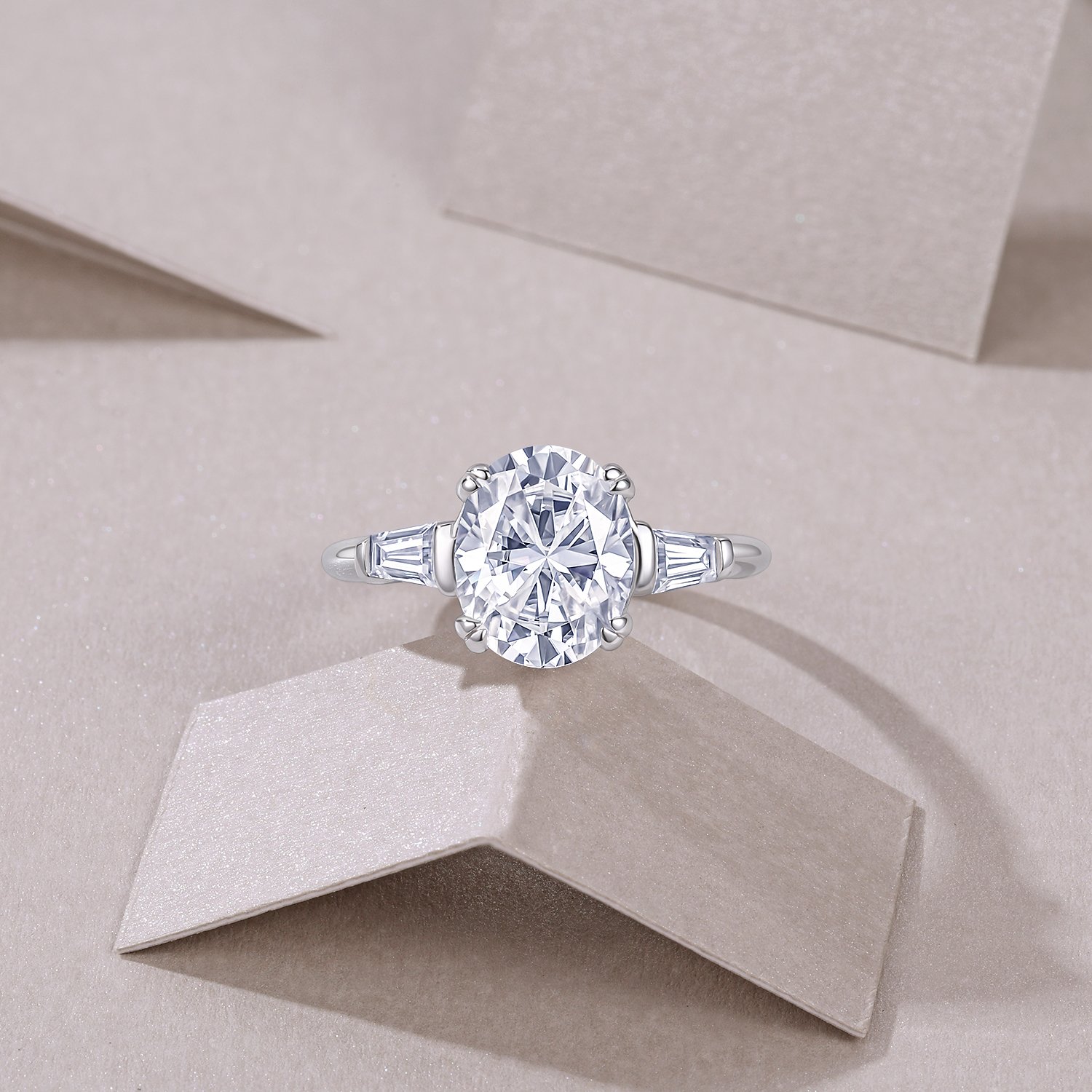 Oval Moissanite Three-Stone Ring with Tapered Baguettes - Image 4