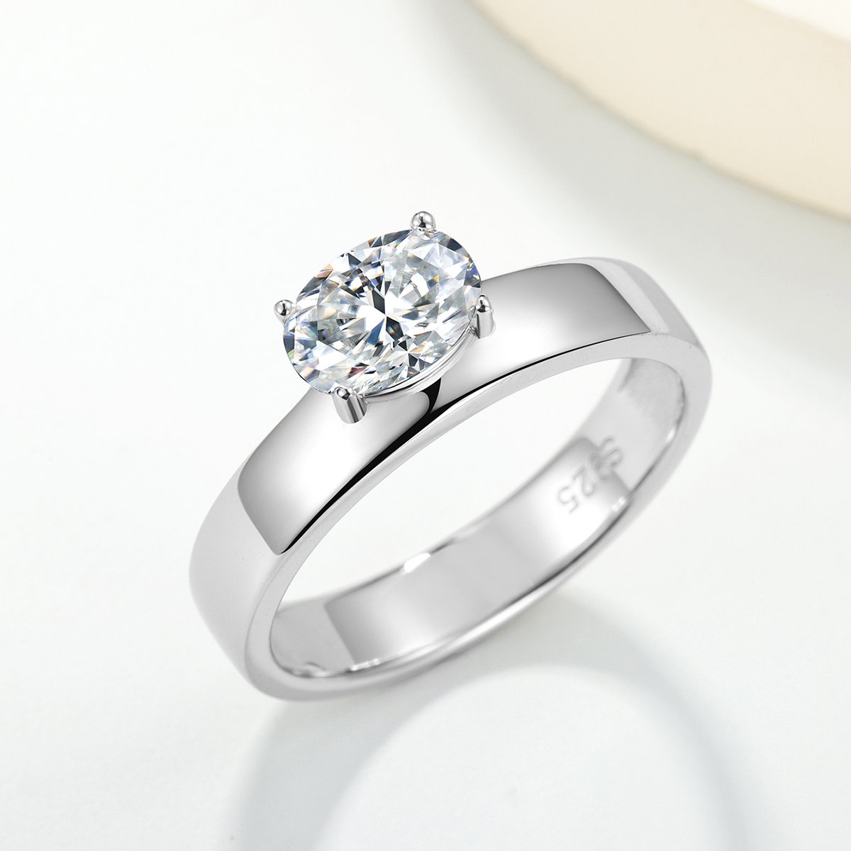 East-West Oval Moissanite Solitaire on a Polished Flat Band Ring - Image 2