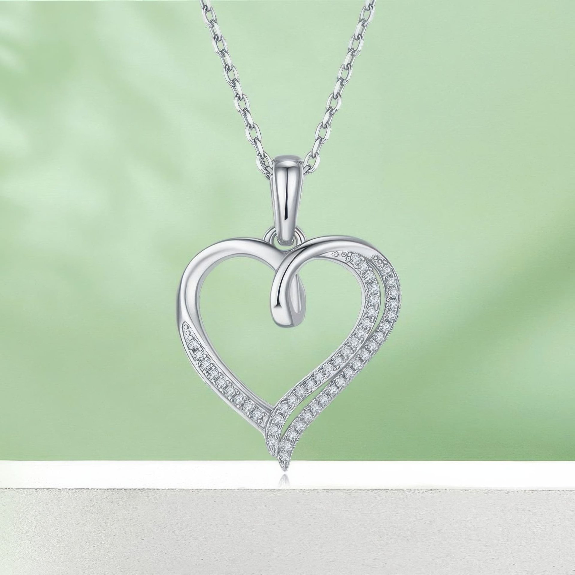 Ribbon Twist Heart Moissanite Pendant Necklace | Sterling Silver Open Heart with Looped Crossover Top | 3 Plating Options -...