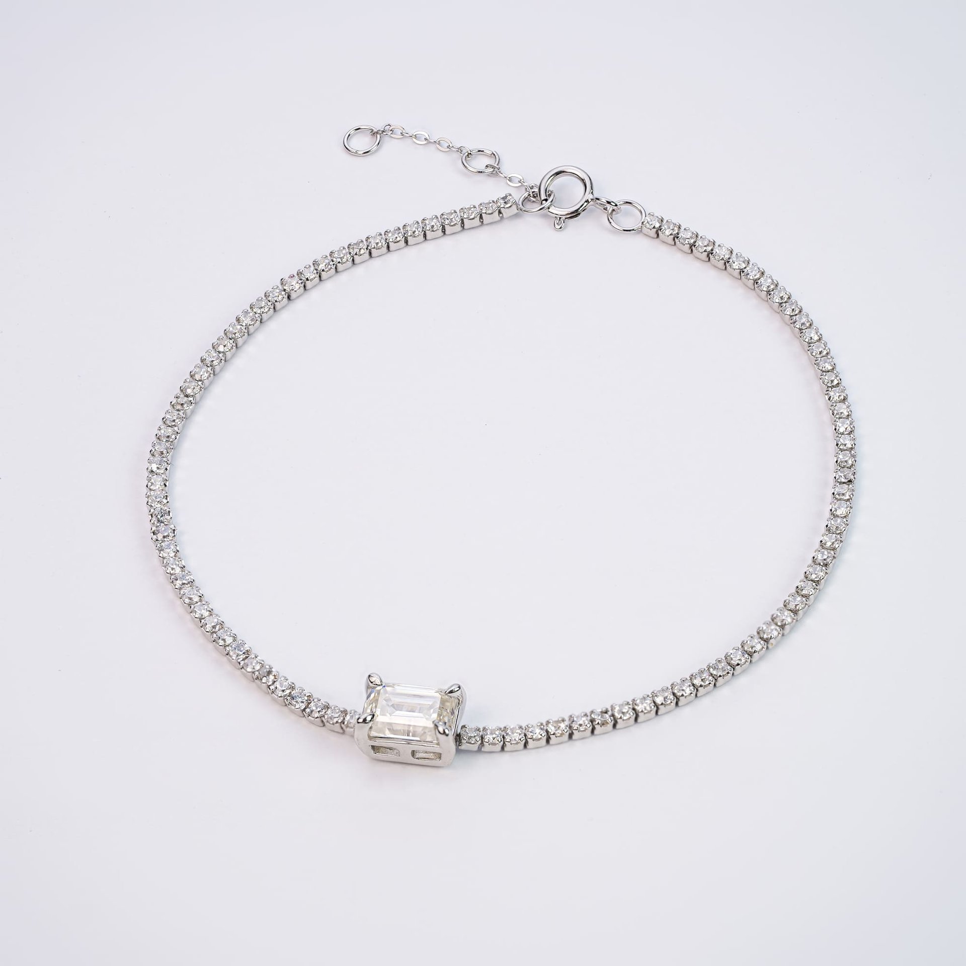 1.5mm Moissanite Tennis Bracelet | Emerald-Cut Center Stone in 925 Sterling Silver