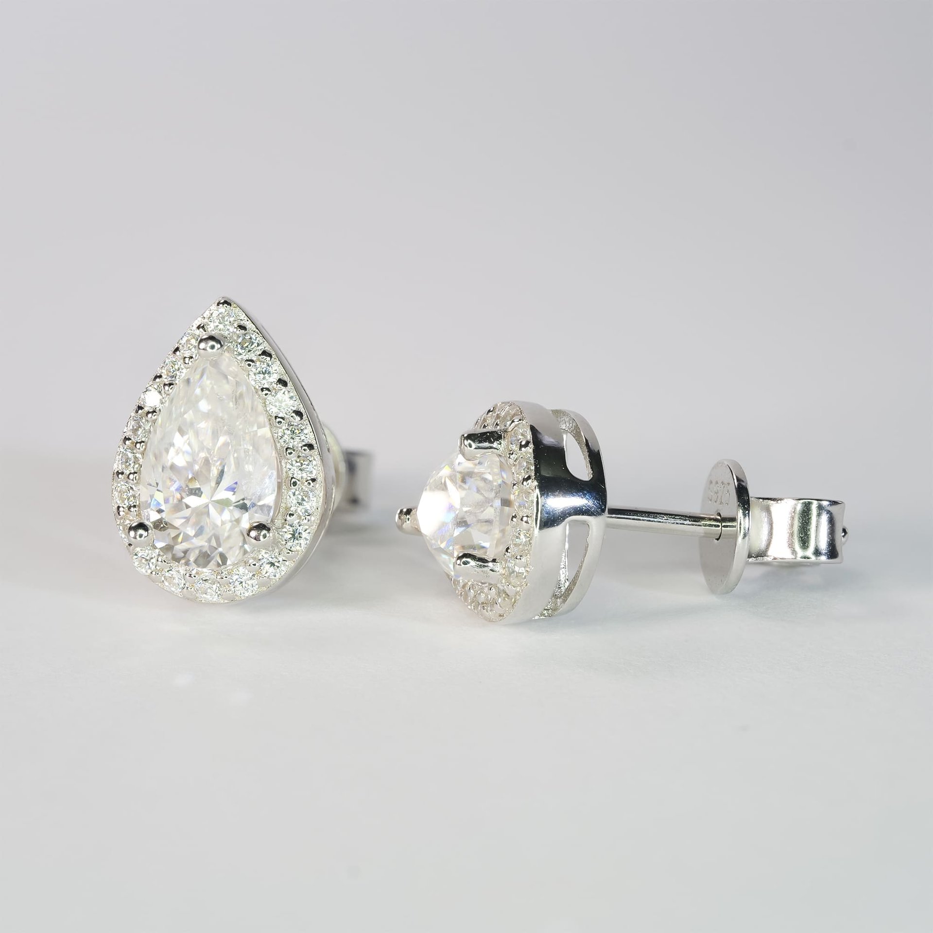 Pear-Cut Moissanite Halo Stud Earrings | 1ct DEW (6.5mm) Center | DEF VVS | 925 Sterling Silver - Image 4