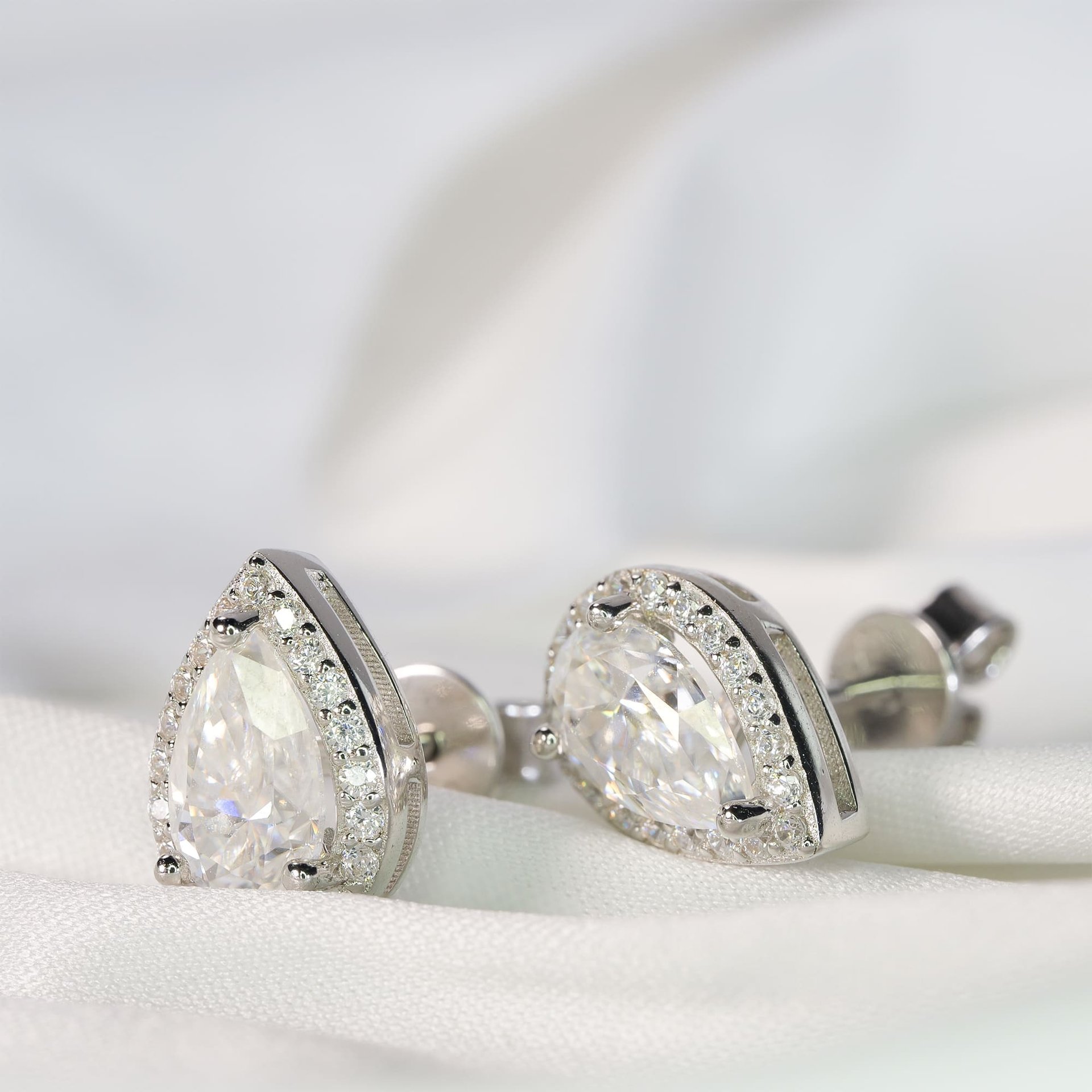 Pear-Cut Moissanite Halo Stud Earrings | 1ct DEW (6.5mm) Center | DEF VVS | 925 Sterling Silver - Image 5